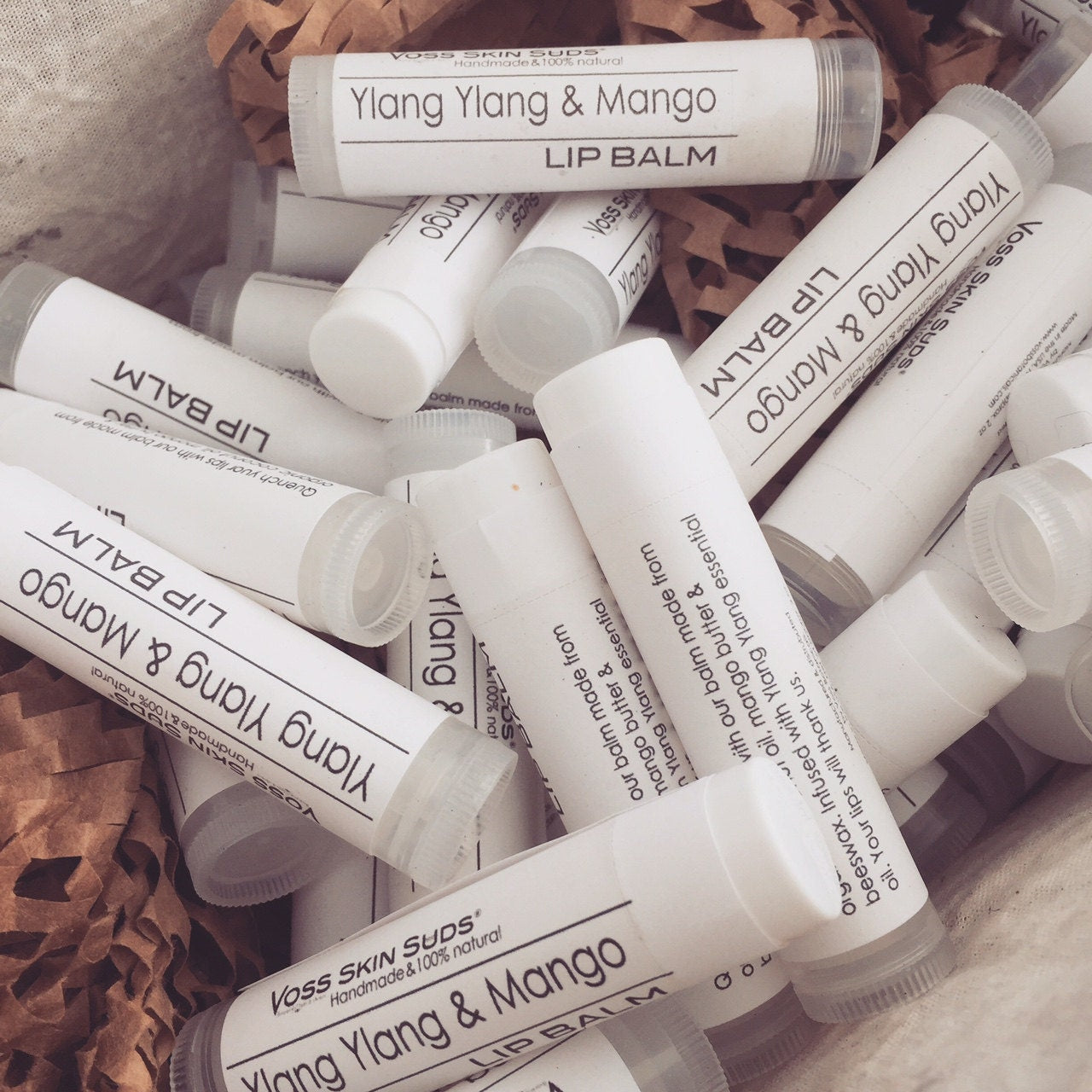 Mango butter and ylang ylang lip balm PRODUCT FOOTPRINTS Natural ingredients Phthalate, Sulfate, Petroleum & Paraben Free Vegan Free of Synthetic Fragrances Free of Synthetic Dyes GMO & Gluten-free Non Toxic Handmade Sustainable Innovation Made in the USA Cruelty Free Zero Waste Low Carbon Footprint eco friendly   Holiday care package gift box gift for her relaxation gift self care box self care gift box spa gift box spa gift set thank you gift box birthday gift new mom gift
